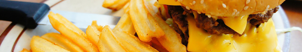 Eating American (Traditional) Burger at Airways Hamburger restaurant in Arlington, TX.